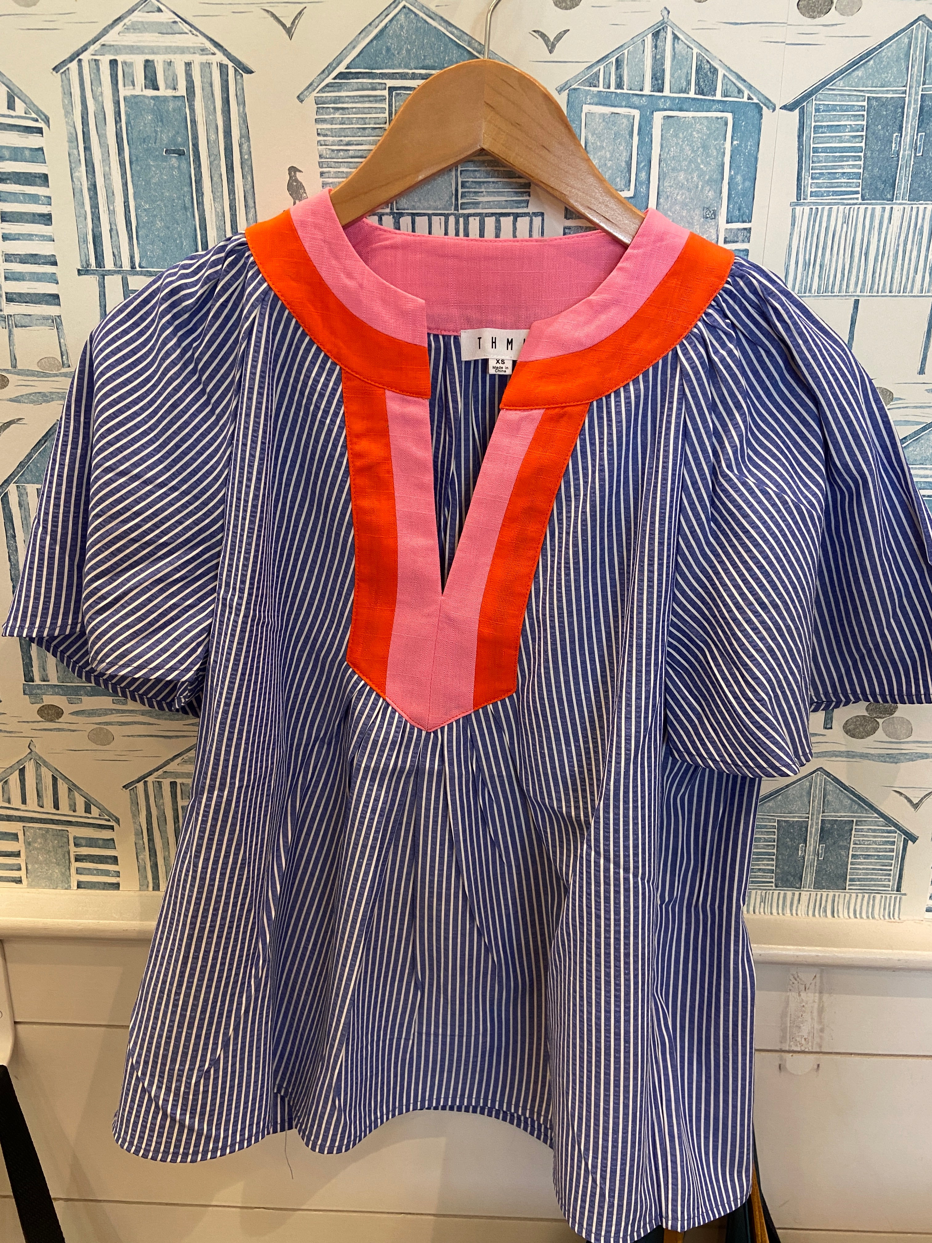 Blue striped flutter sleeve blouse with pink orange collar